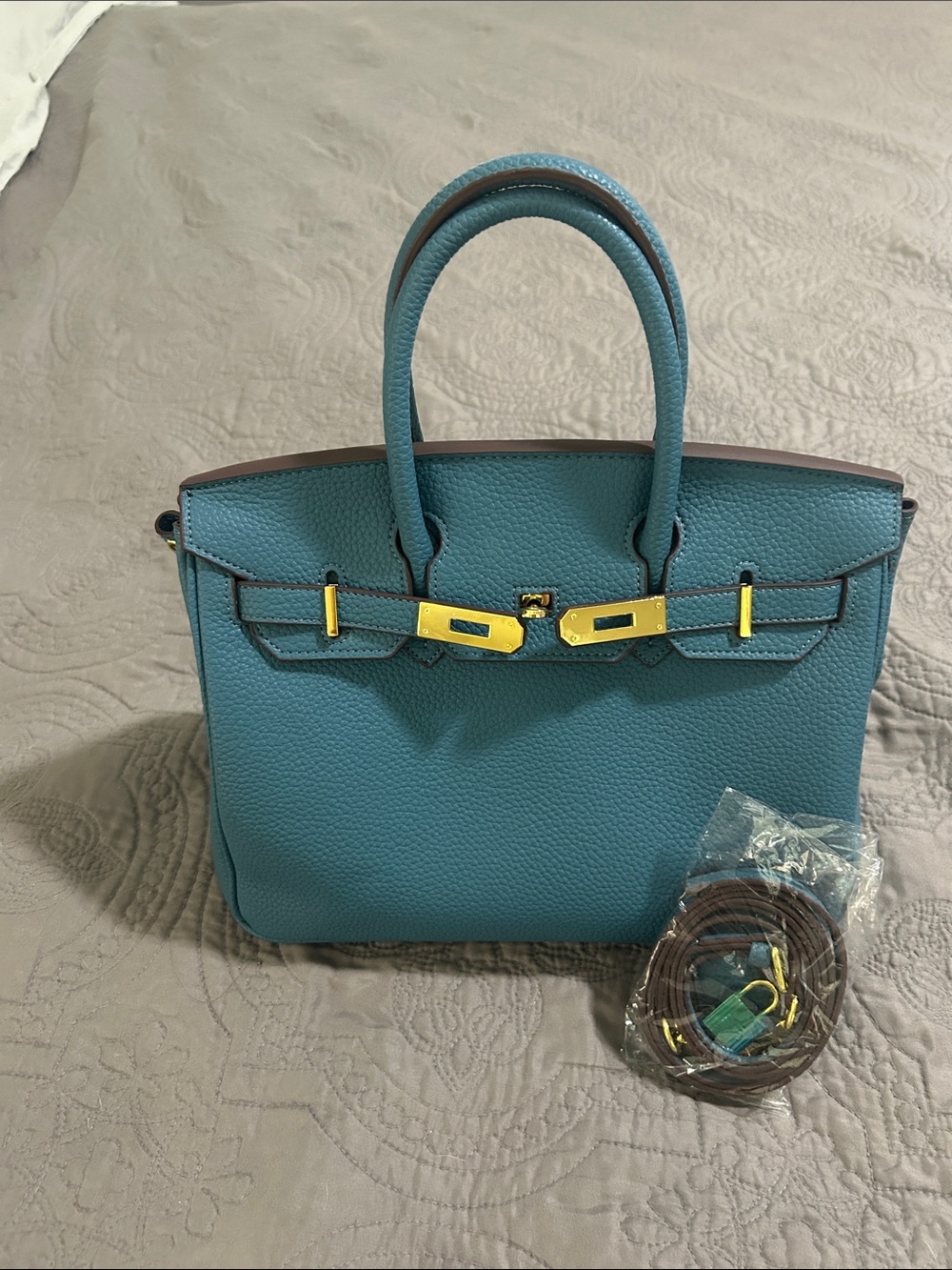 WIRKIN BAG.  Denim Blue Leather Bag with Gold Hardware